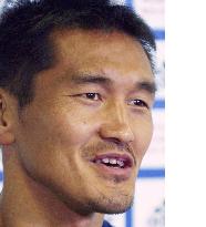 Japan defender Akita meets press